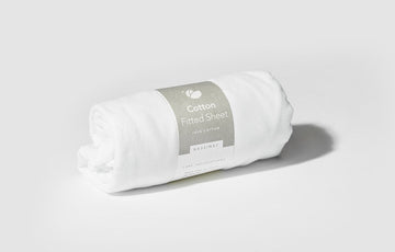 Bassinet Fitted Sheet rolled up in packaging
